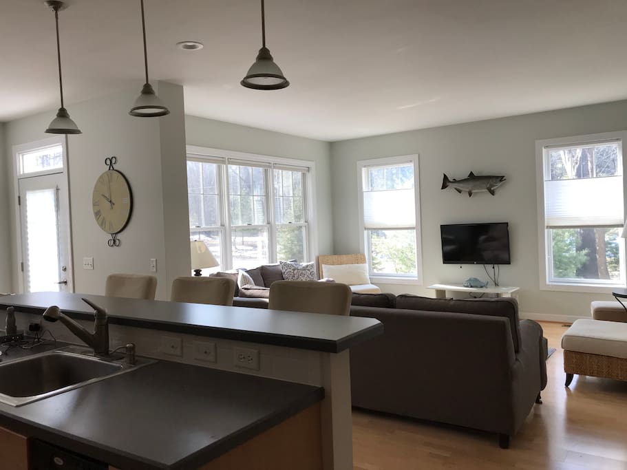 Open floor plan of living room, dining and kitchen