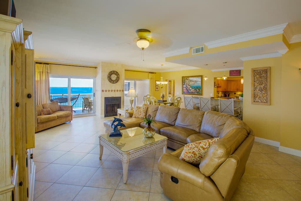 Great room with leather sofa and fabulous Gulf views.