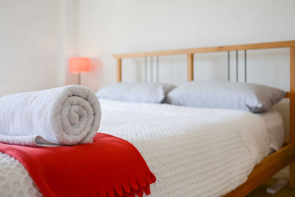 Master bedroom with private bathroom and city views