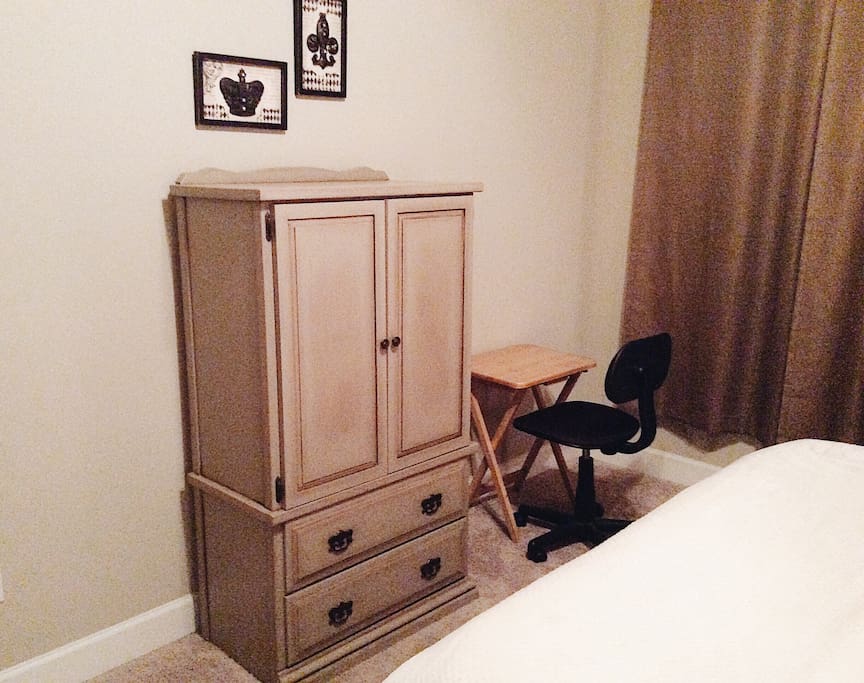 Unpack into this dresser and the hanging space in the closet. And the workstation is by the window.