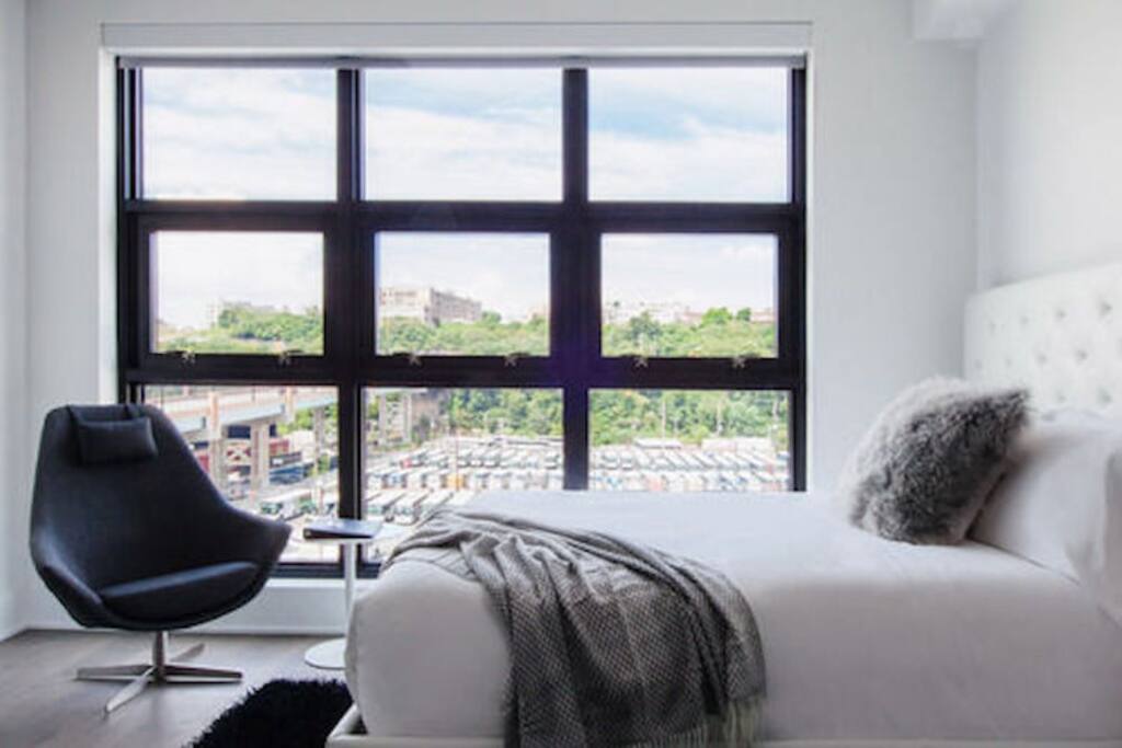 Studio Apartment Stunning Views Providing an Outdoor Feel and Capturing the Dynamic Weather Changes While Also Updating The Interior with Natural Ambiance