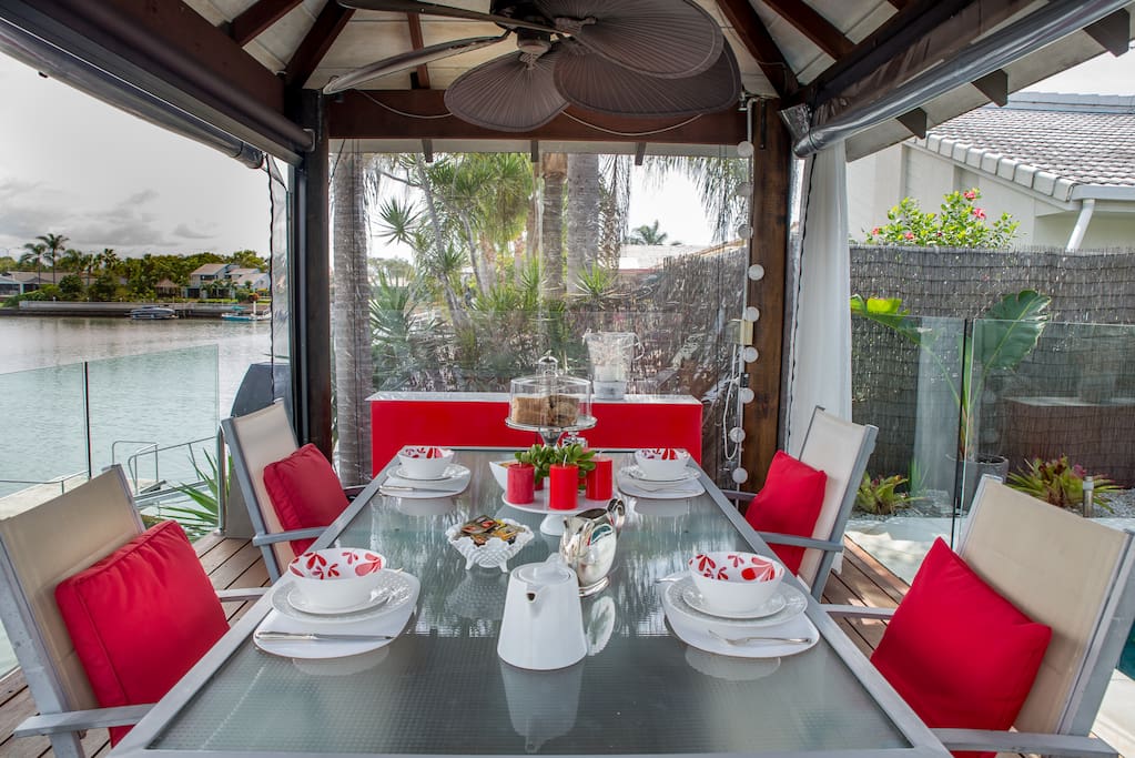 Dining table in the Cabana on the waterfront at B and B on the Bay your Gold Coast Accommodation