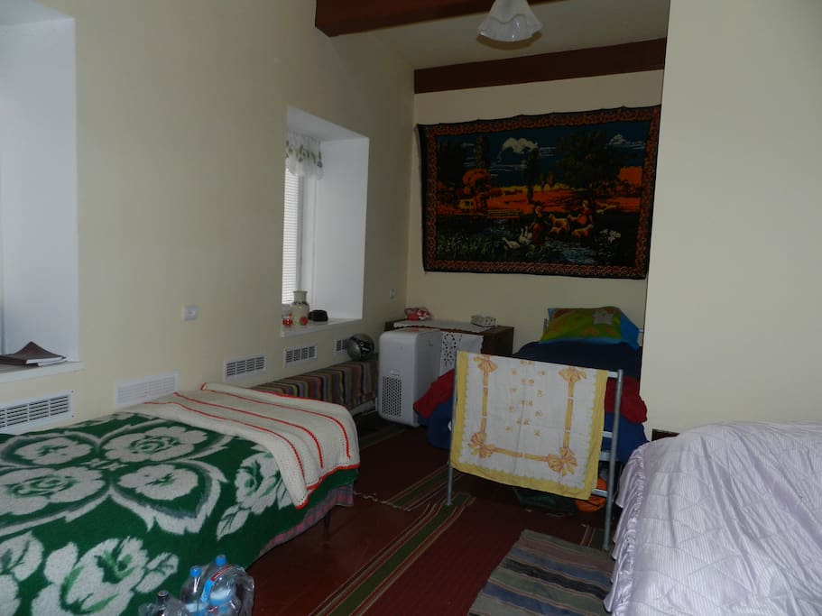 original wood floors, 3 single beds in this room