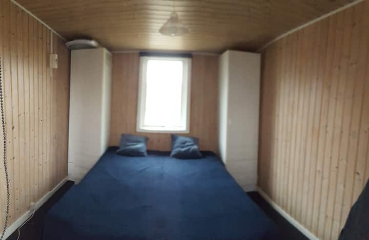 room no. 2 with  2 beds and space for children's travel bed that is free to use here. the room is in the annex in extension of the house. annex is built together with the house  with a covered terrace as a walk-through.