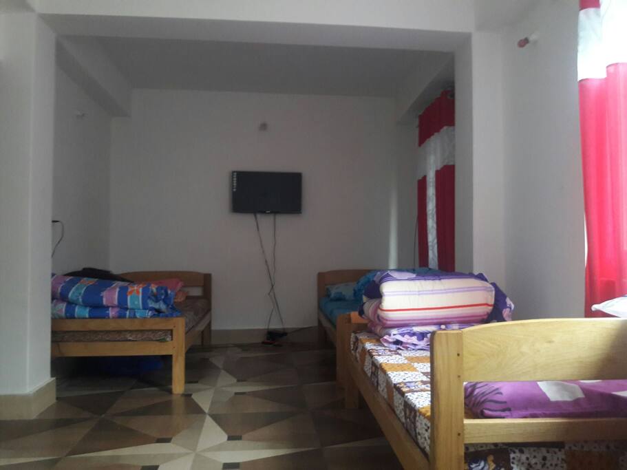 dorm with four beds, tv, water boiler, heater also available, common toilet bathroom