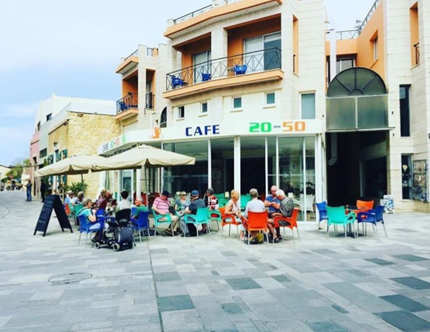 The building from outside and the cafe.