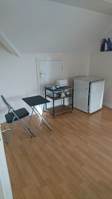 Table and chair to eat or work from.