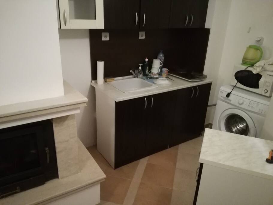 Kitchen unit and fireplace in the sitting room
