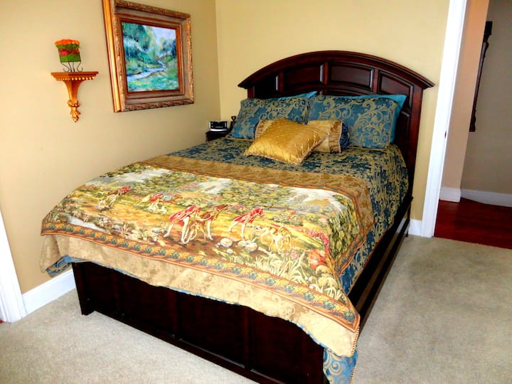 This large bedroom shares a Jack-and-Jill bath with another bedroom. This bedroom has a panoramic bay window area with a rosewood desk overlooking the historic district. 