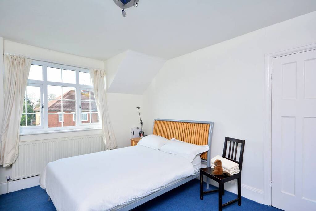 Front bedroom, spacious, warm, light and bright. Double bed, built in wardrobe.