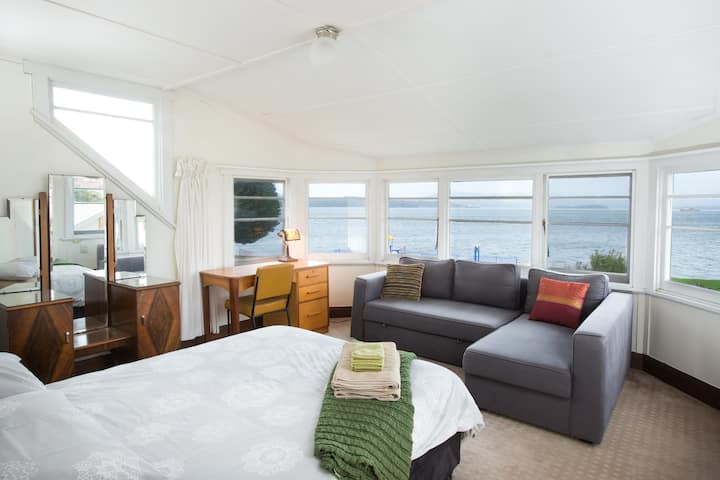 Double bedroom with sofa bed overlooking the deep water harbour of the Tamar River.