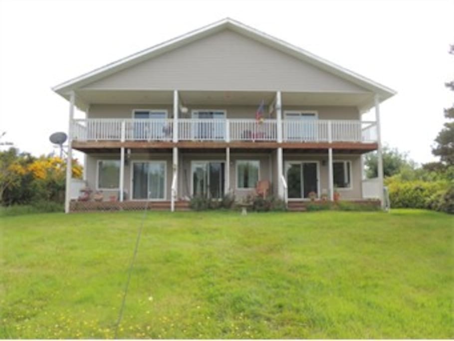 Two level condo is on the right, as viewed from dock