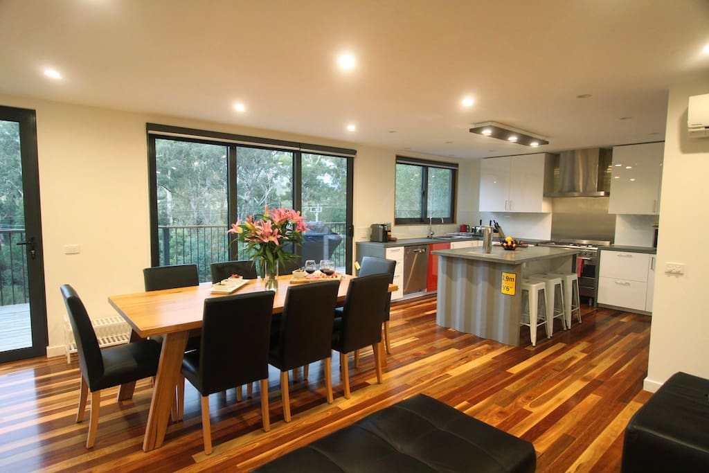 Open plan living, with kitchen, lounge and dining.