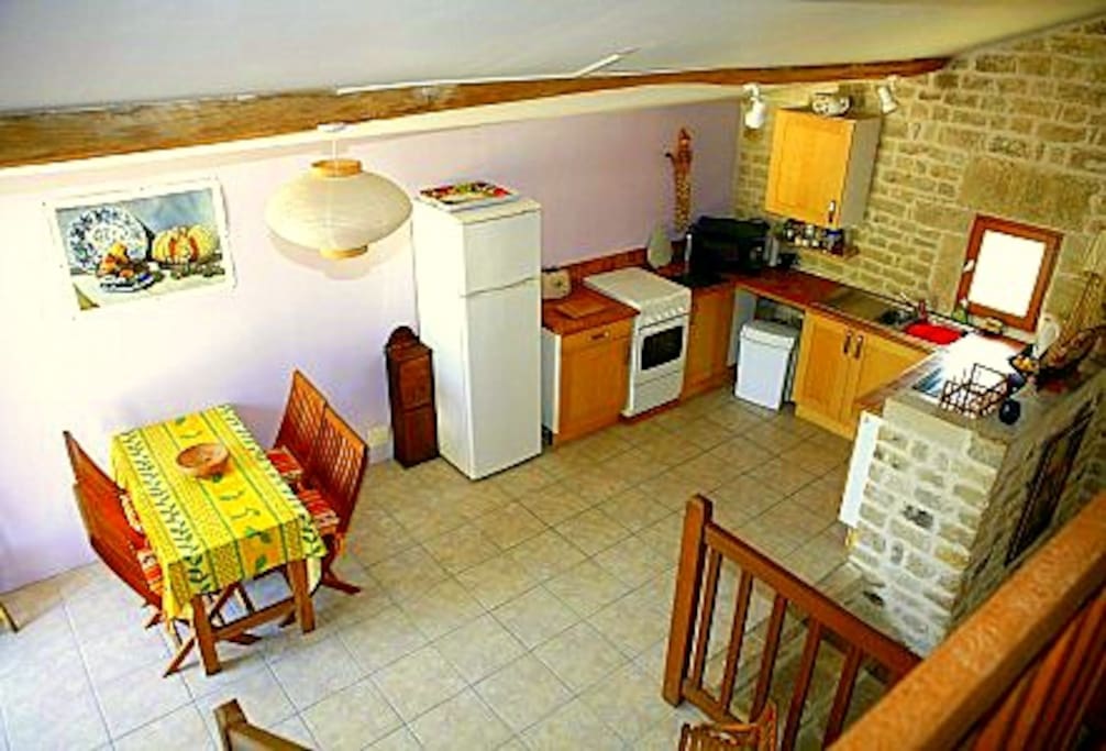View of fully equipped kitchen from landing