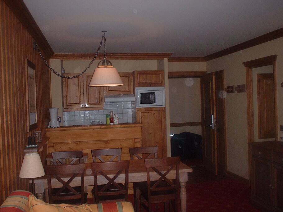 Kitchen area with Fridge, Microwave Oven, dishwasher and hob.