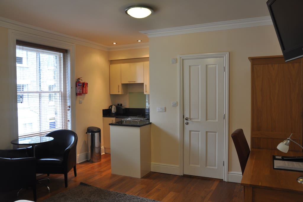 Kitchen and en suite in this one room studio apartment