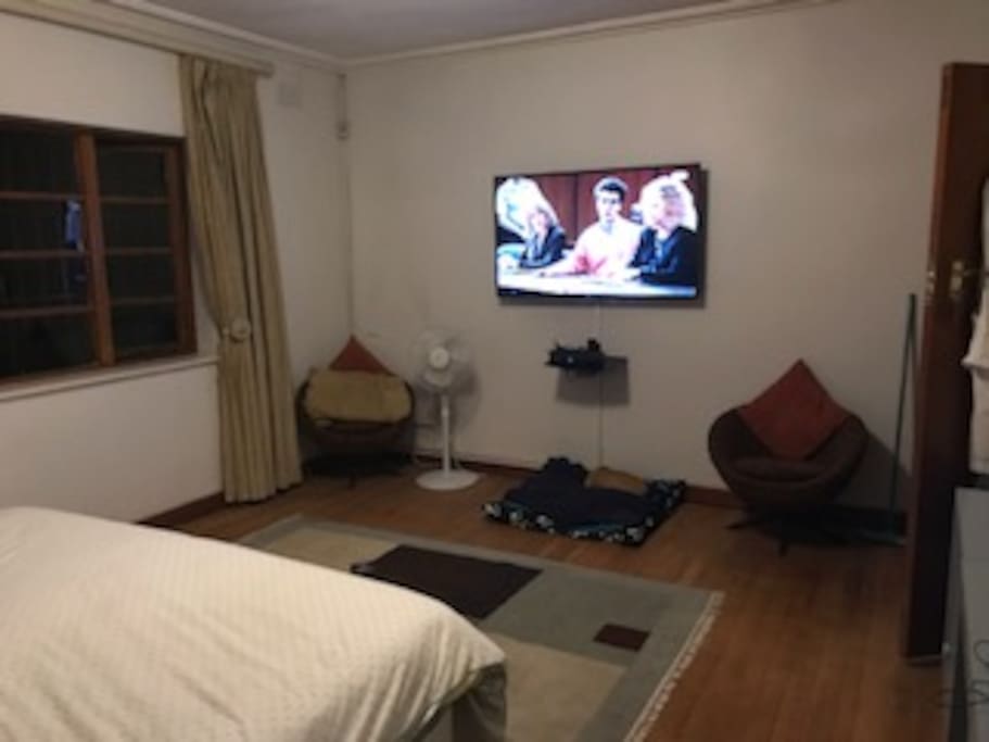 Main bedroom with large TV