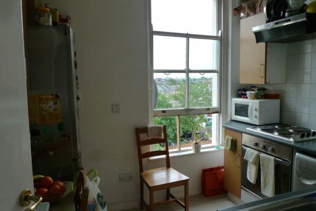 Our kitchen is fully equipped and gets a lot of light with a lovely view of London