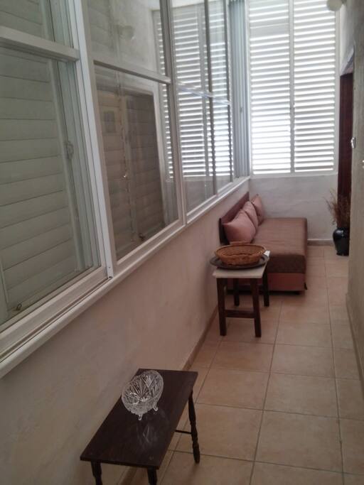 closed balcony with couch bed