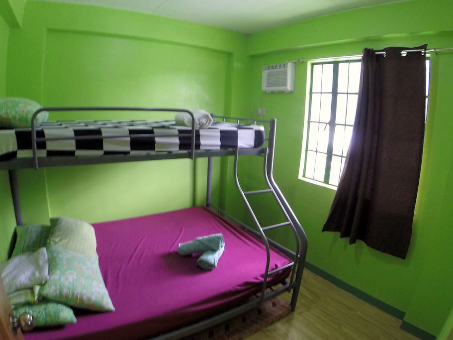 Air-conditioned bedroom, bunk beds with 6" foam mattresses. Very comfy. Double on bottom, single on top, floor mattress for additional guests.