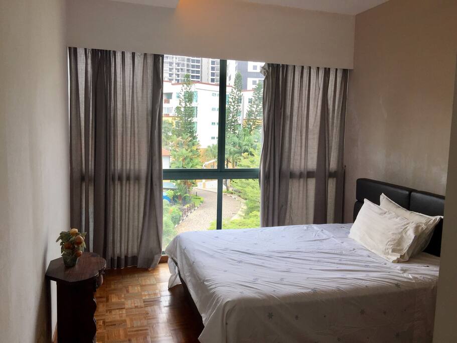 Master bedroom overlooks the pool. Queen size bed, 10- inch mattress