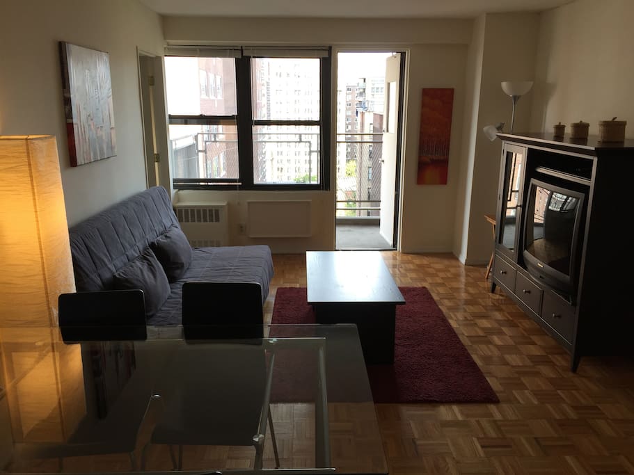Functional, clean and open space in the dining and living room. Access to the balcony