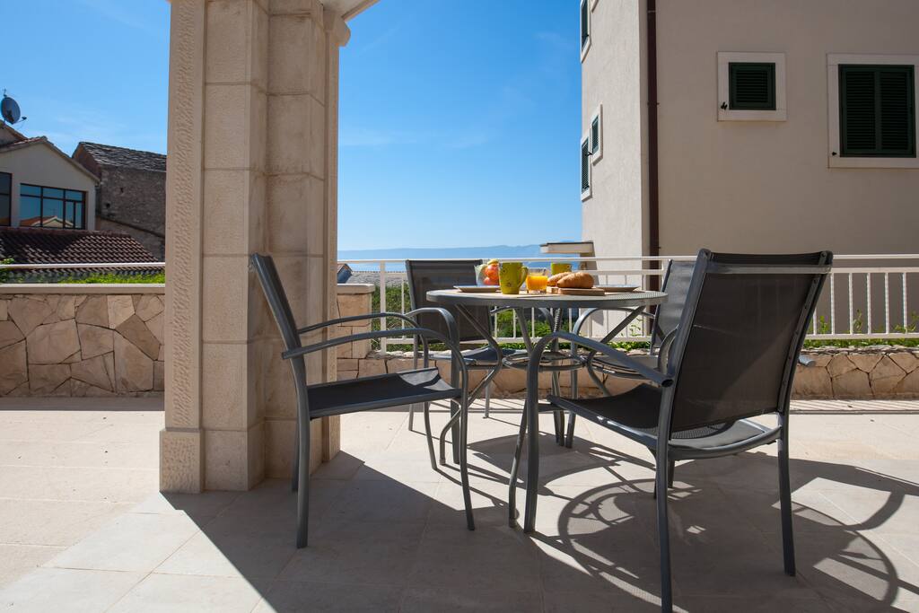 terrace with dining table for 4