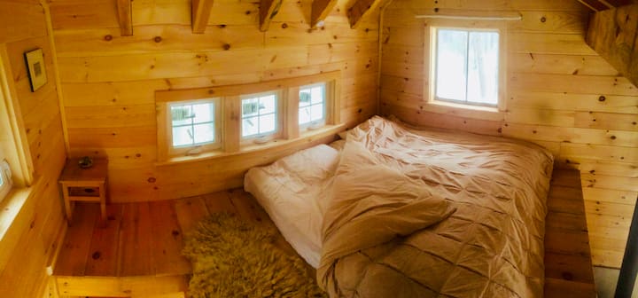 Sleeps two in the 8'x8' loft.  Plenty of windows to let in morning light.