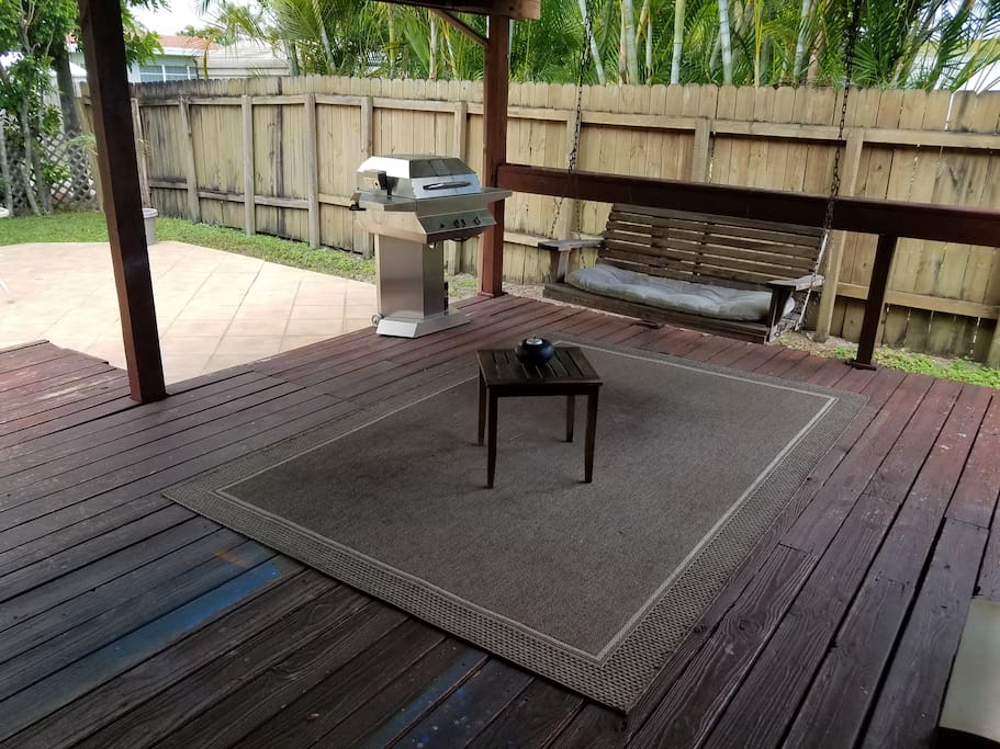 Grill and chill backyard with swing