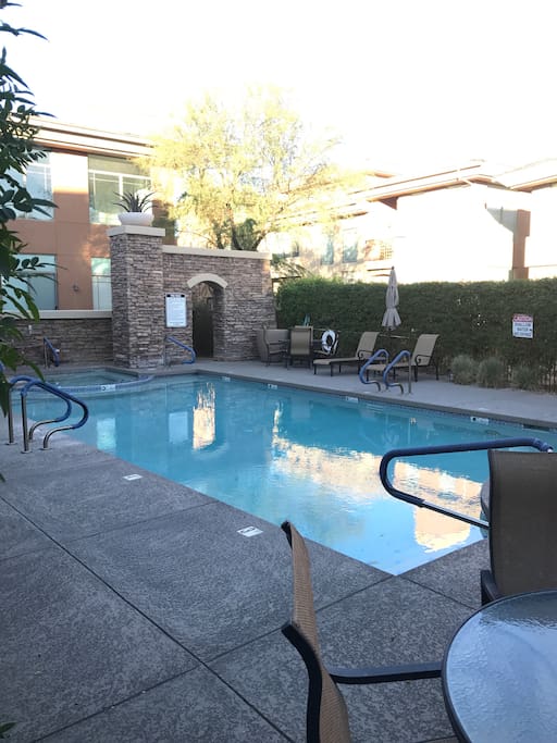 Community Pool and heated hot tub with BBQ Grills