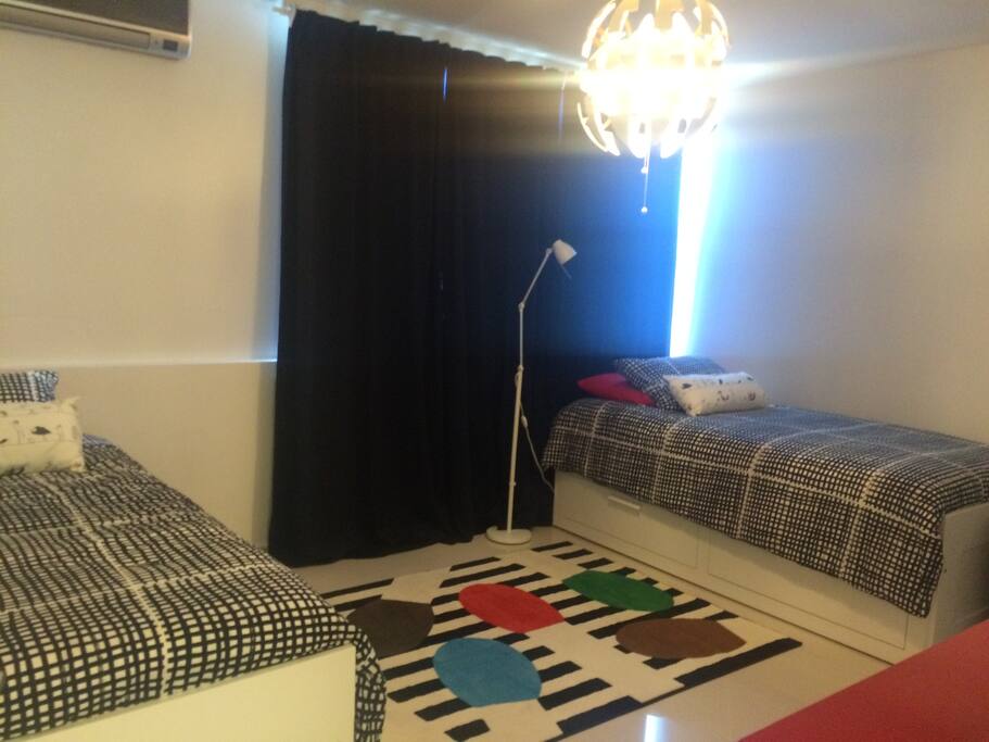 Spacious bedroom sleeps up to four.