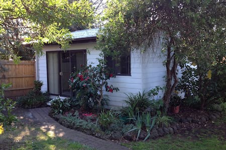 Self contained bungalow in suburban backyard.