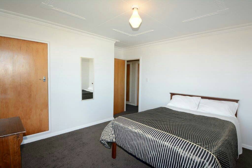 bedroom with view of ocean
