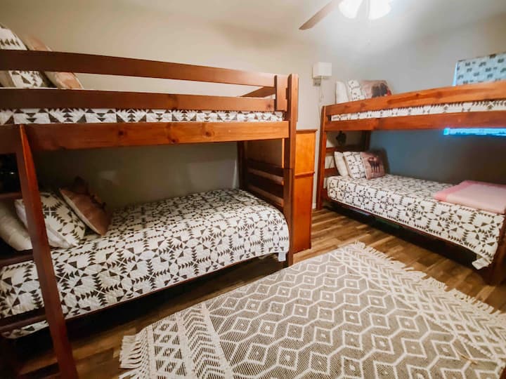 Boo from the bunk room! This room features two bunk beds for dreamers aged 0-99 and a dresser.