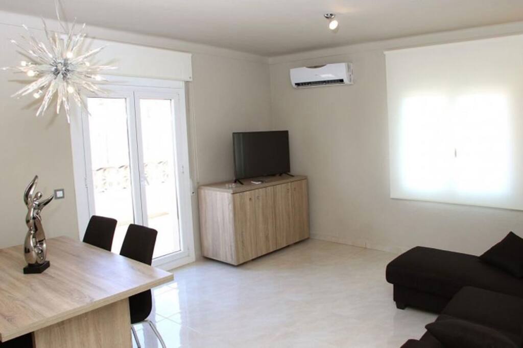 Sit back in this bright space and catch a show on the flat-screen TV.