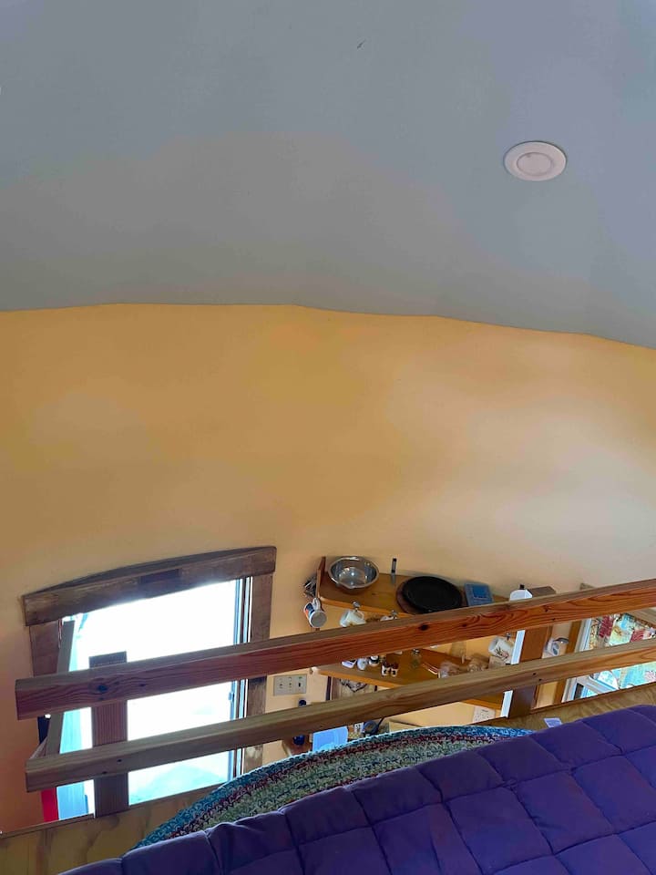 A view from the loft down to the front door; Spring 2023