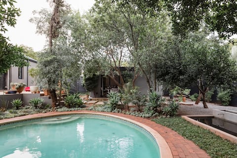 Chill Among the Lush Foliage at a Tranquil Poolside Oasis