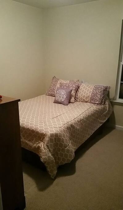 Cozy bedroom with a Full size bed, Dresser and small closet.