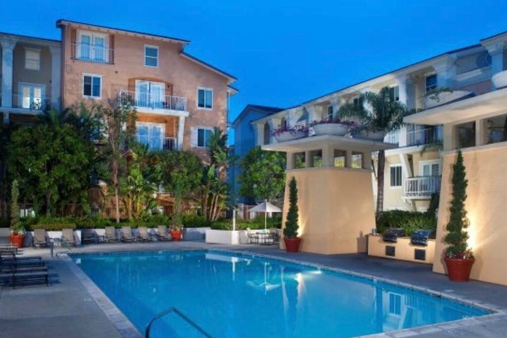 Luxury Olympic size swimming pool with barbecue grills.