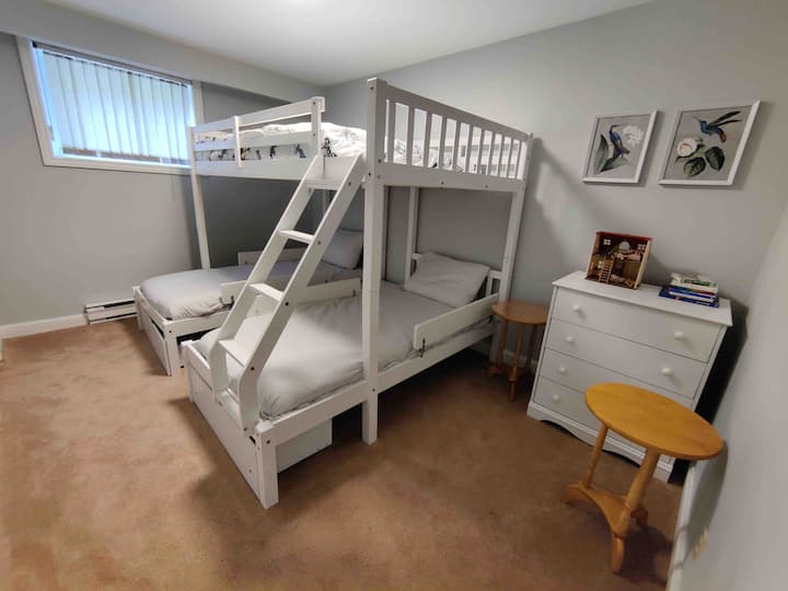 Bunk bed with double on top, and two singles at the bottom. This is meant for children.