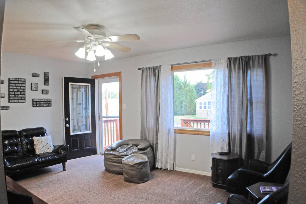 Living Room, couch, 2 chairs, plus oversized super chill beanbag chair. Additional air mattress available for this area if needed.