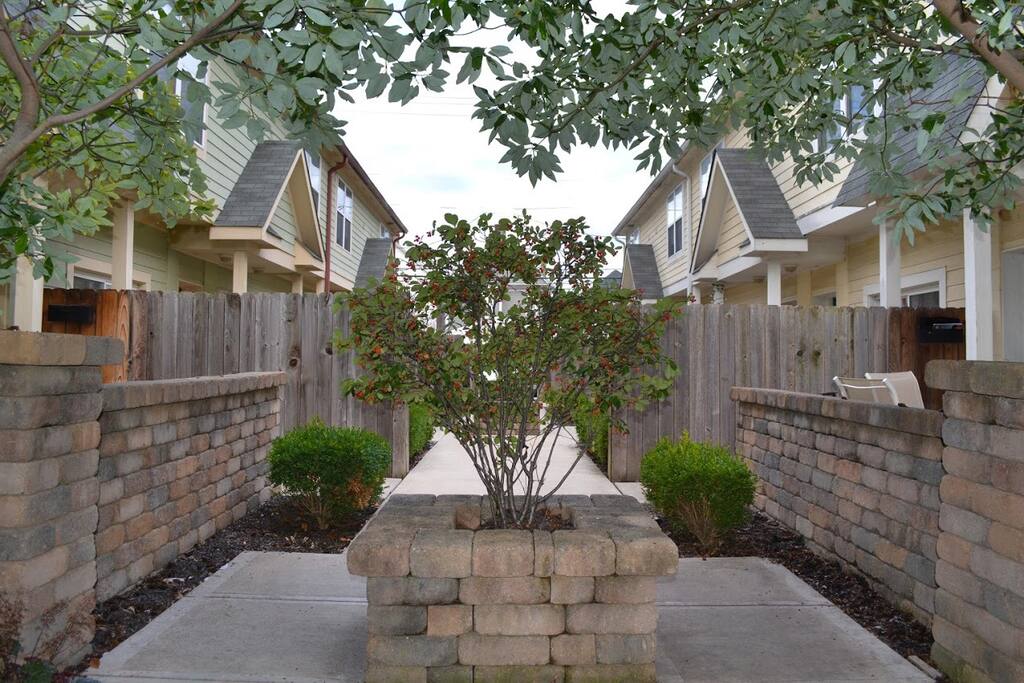 Private entrance off charming secluded community walkway.