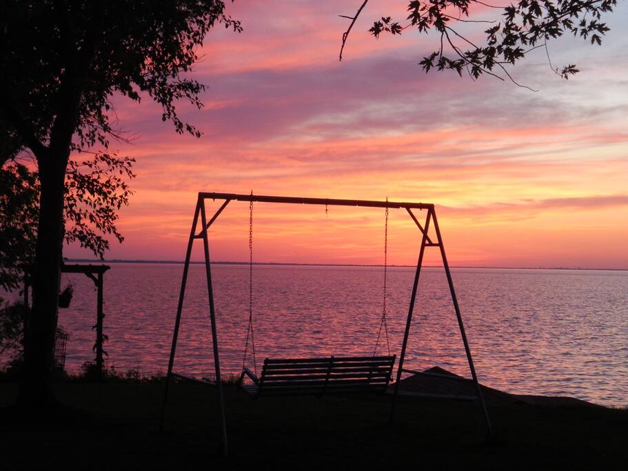 swing bench at sunset
