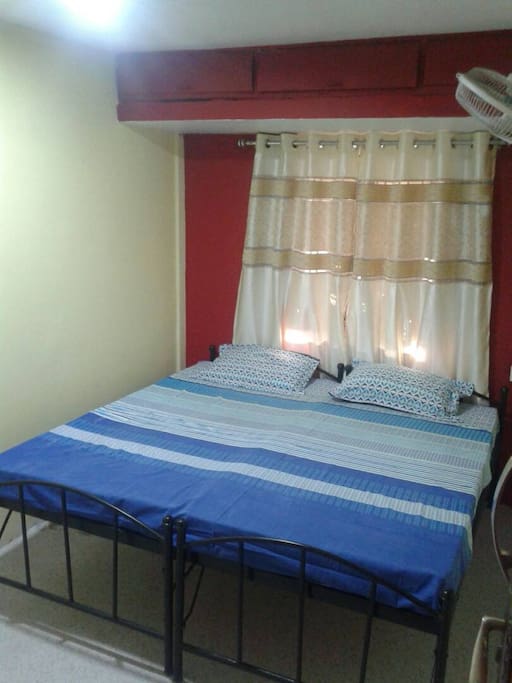 Modern spacious double bed can be split to make two single beds.