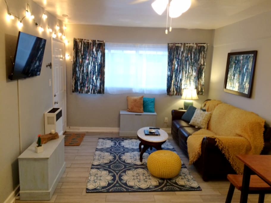 Cozy Living Room With A Nice Couch & Beachy Decor