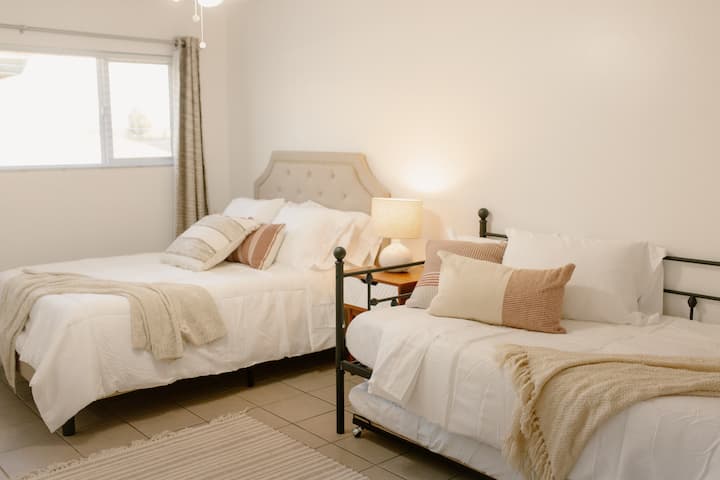 second bedroom with double bed and twin bed with trundle