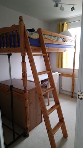 Single bed with desk & blackout blind