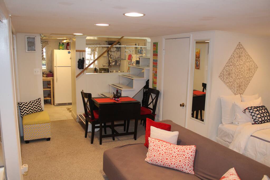 Dinning area with kitchenette in the background and bath door to the right