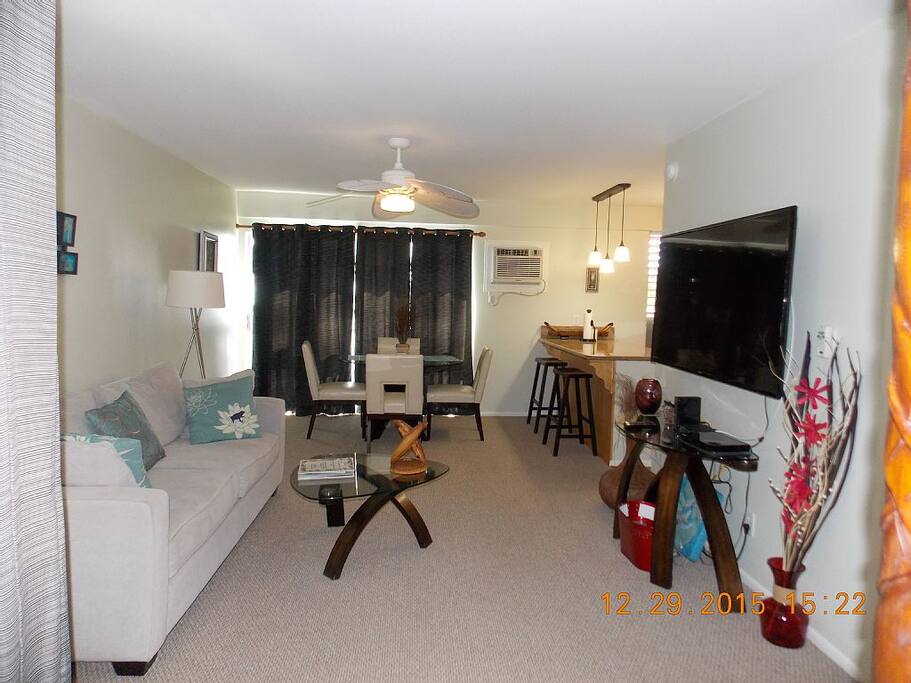 Living room, dining room with 60" Samsung T.V.