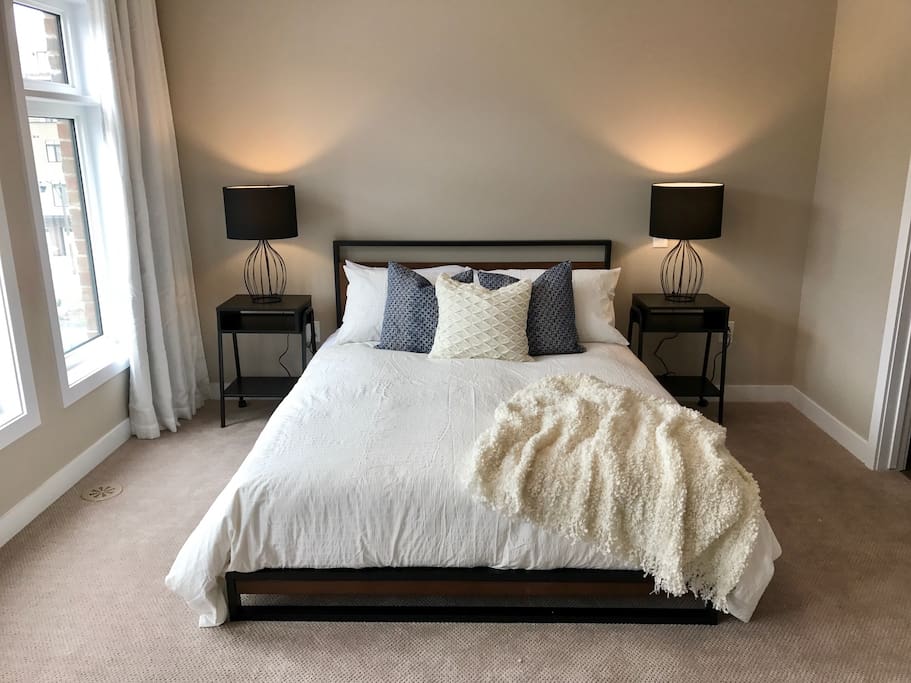 Gorgeous master bedroom with black-out curtains for sleeping privacy